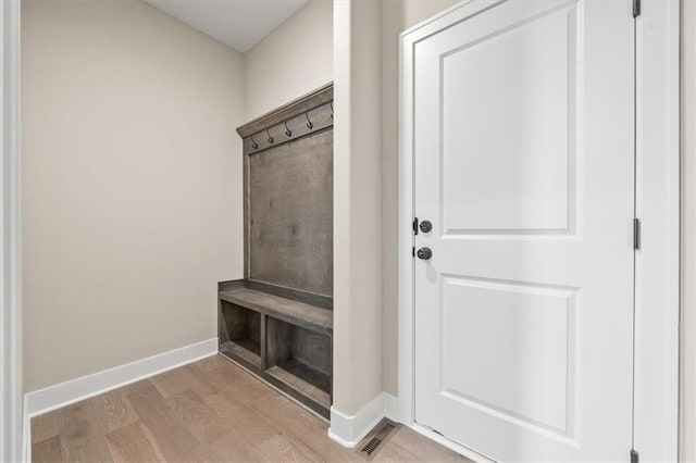 mudroom with light hardwood / wood-style floors