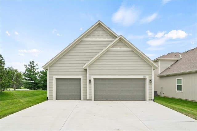 view of front of house featuring a garage and a front lawn