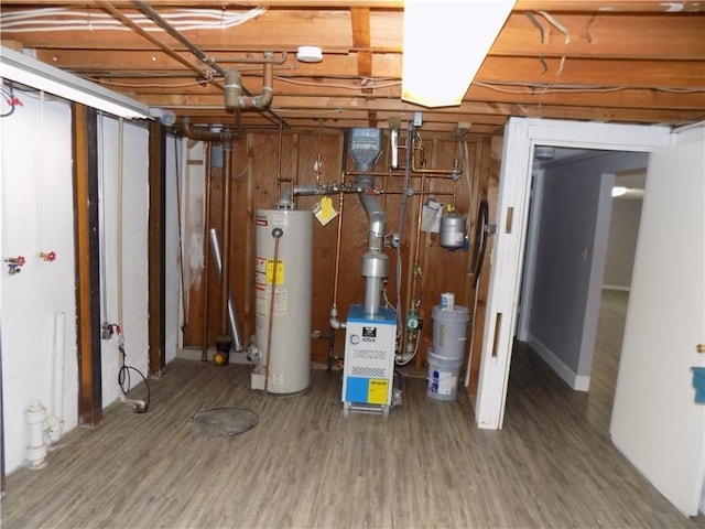 unfinished basement with wood finished floors and water heater