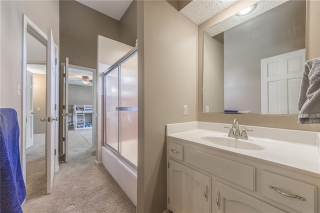 bathroom featuring vanity and shower / bath combination with glass door