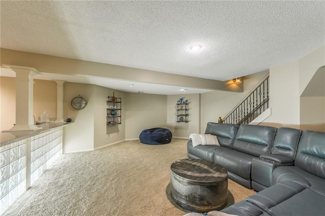 carpeted living room featuring a textured ceiling