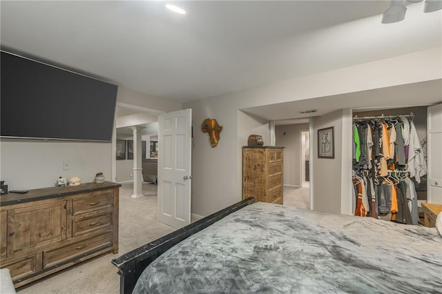 carpeted bedroom featuring a closet and ceiling fan