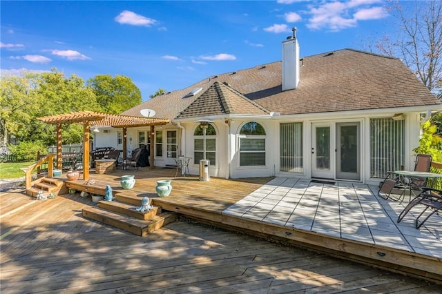 back of property featuring a wooden deck