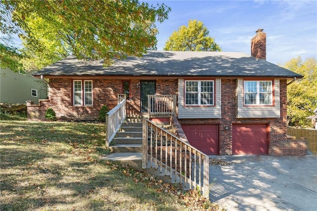 view of front facade featuring a front lawn and a garage