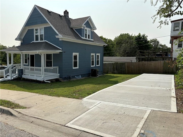 view of property exterior with a yard, a porch, and cooling unit