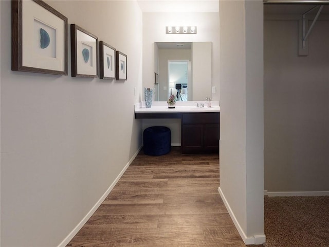 bathroom with vanity and wood-type flooring