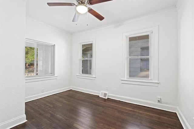 unfurnished room featuring ornamental molding, ceiling fan, and dark wood-type flooring