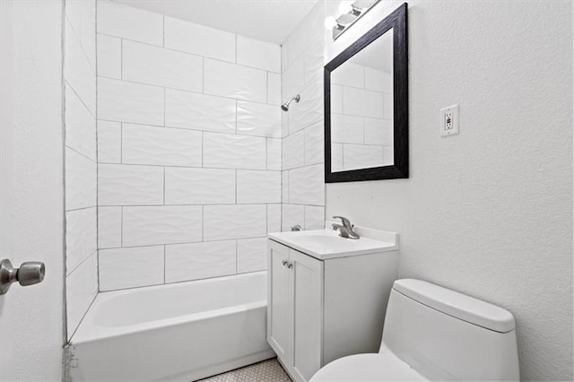 full bathroom with tiled shower / bath combo, vanity, and toilet