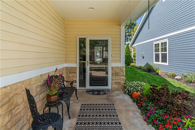 property entrance featuring a patio