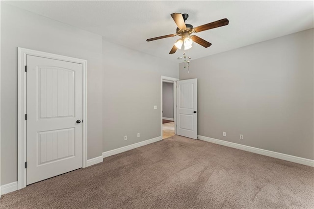 unfurnished bedroom with ceiling fan and carpet flooring