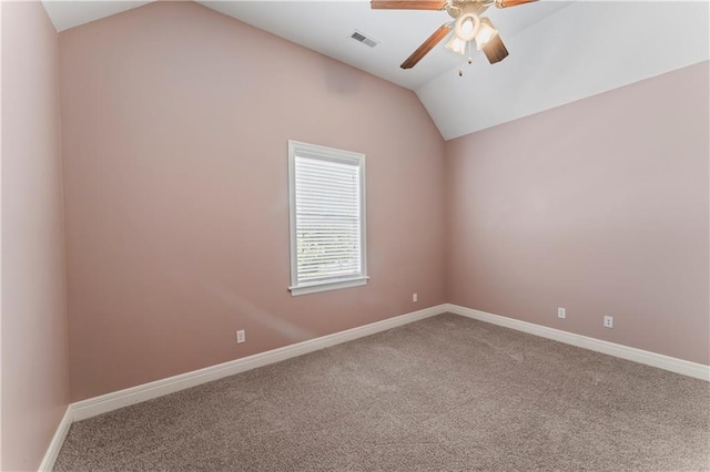 carpeted empty room with lofted ceiling and ceiling fan