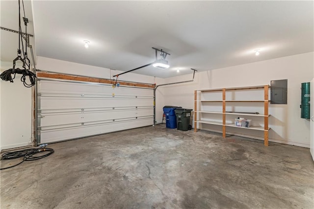 garage featuring electric panel and a garage door opener