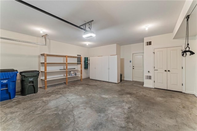 garage featuring a garage door opener and electric panel