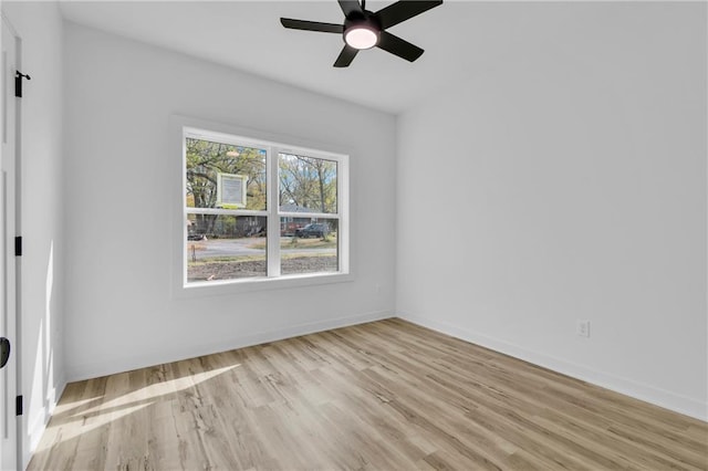 unfurnished room with light wood-type flooring and ceiling fan