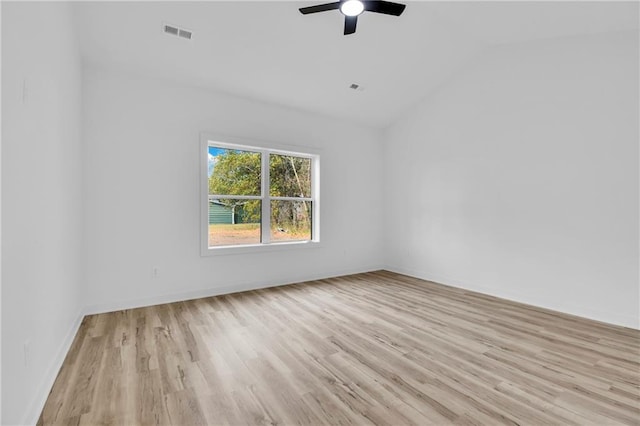 unfurnished room featuring light hardwood / wood-style floors, ceiling fan, and vaulted ceiling