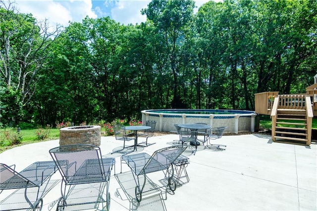 view of patio / terrace featuring an outdoor fire pit