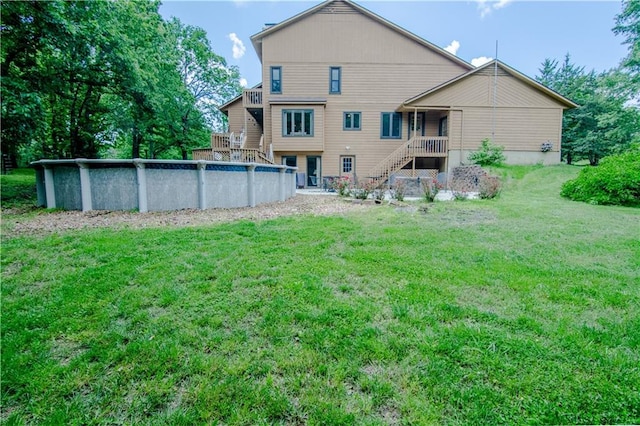 rear view of house with a yard