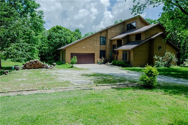 view of front of home featuring a front yard and a garage