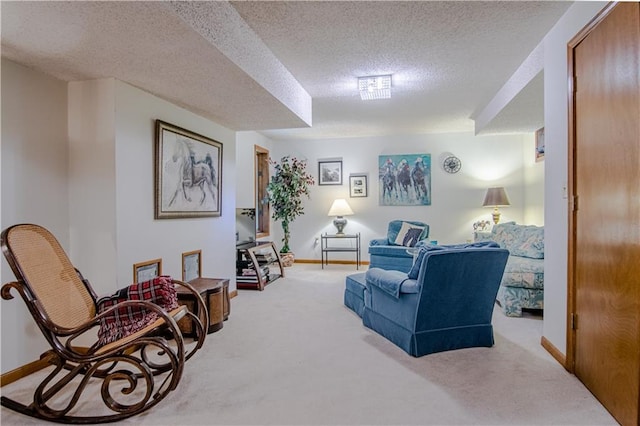 carpeted living room featuring a textured ceiling