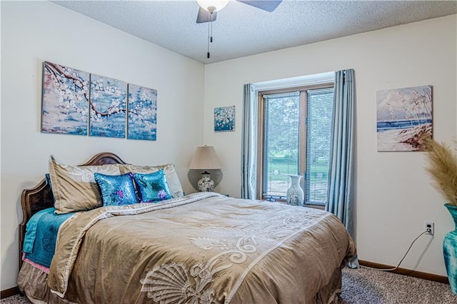 carpeted bedroom with a textured ceiling and ceiling fan