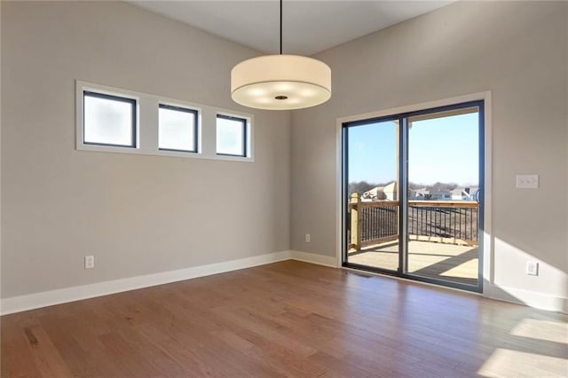 empty room with hardwood / wood-style floors