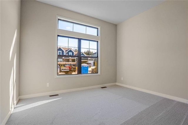 empty room with carpet flooring