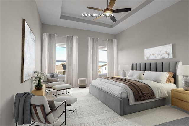 7090 NW Forest Lakes Dr, Parkville, MO 64152 - carpeted bedroom featuring a raised ceiling and ceiling fan