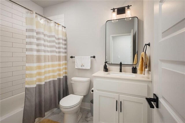 full bathroom with shower / bath combo with shower curtain, toilet, and vanity