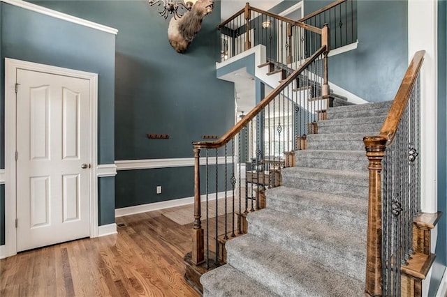 stairway featuring wood-type flooring