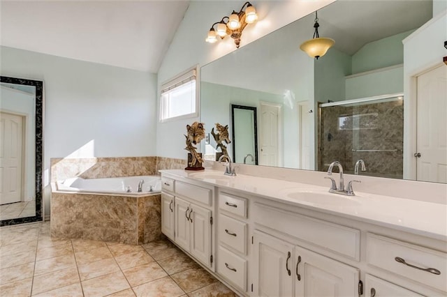 bathroom featuring vanity, lofted ceiling, tile patterned flooring, and separate shower and tub