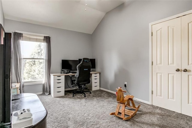 carpeted office with vaulted ceiling