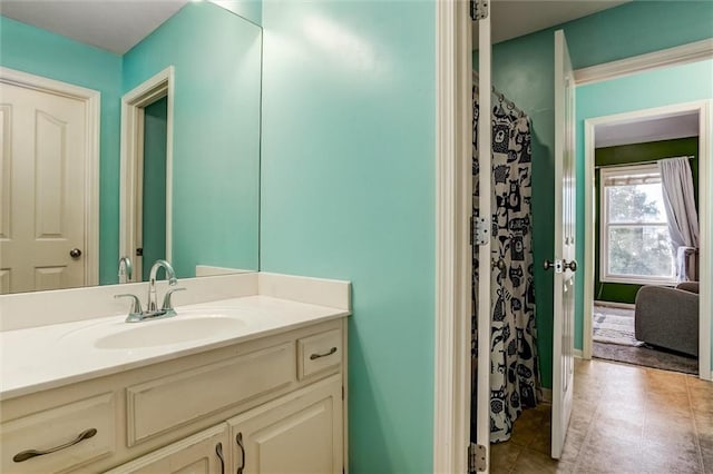 bathroom featuring tile patterned flooring and vanity