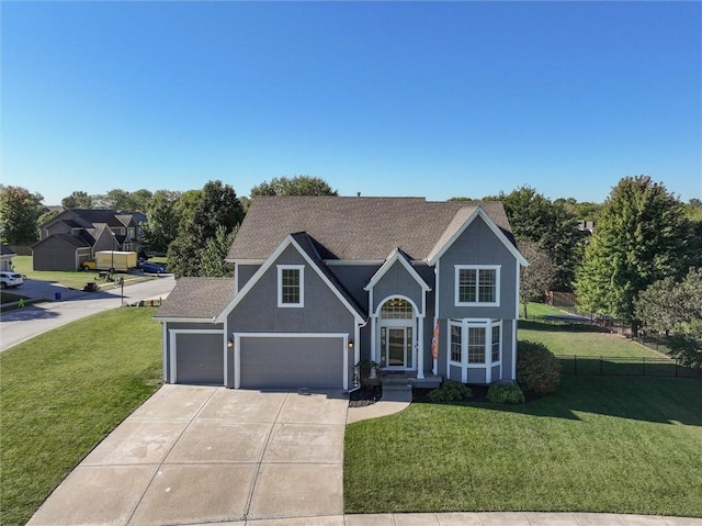 view of front of home featuring a front lawn and a garage