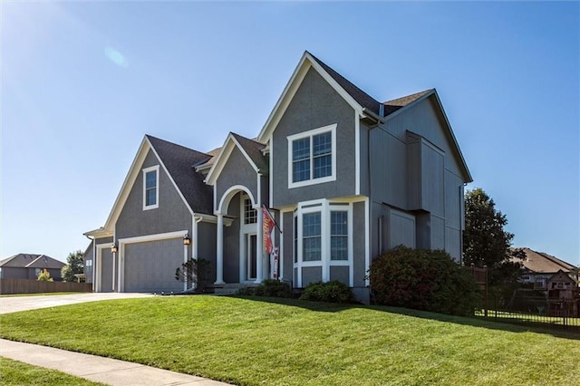 view of front facade featuring a front yard and a garage