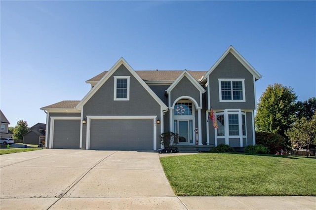 view of front facade with a front yard and a garage