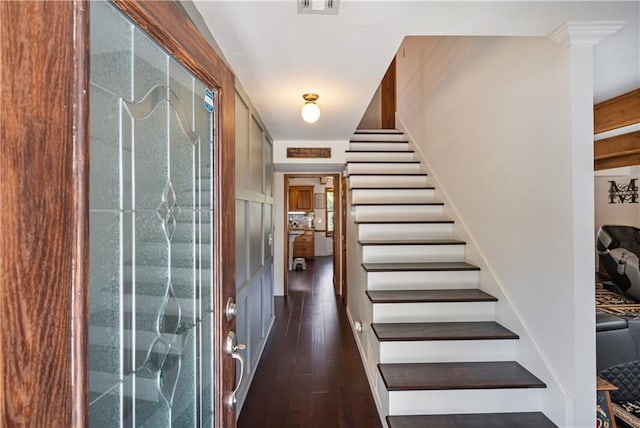 entrance foyer with dark hardwood / wood-style floors