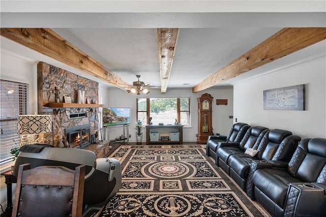 living room featuring a fireplace, beamed ceiling, and ceiling fan