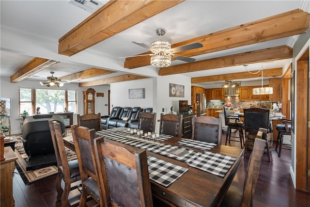 dining room featuring dark wood-type flooring, ceiling fan, and beamed ceiling