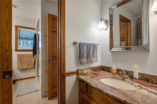 bathroom with vanity and tile patterned flooring