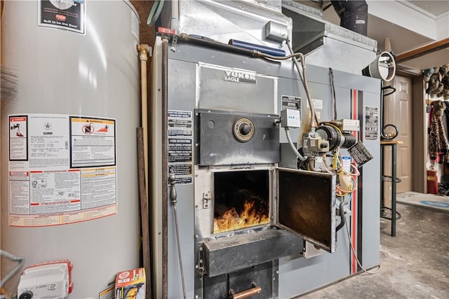 utility room with gas water heater