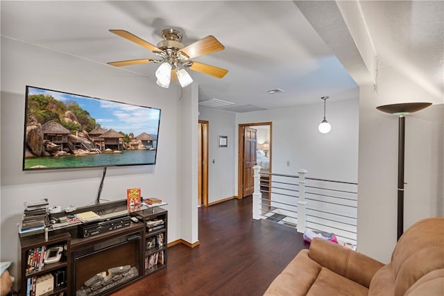 living room with ceiling fan and dark hardwood / wood-style floors