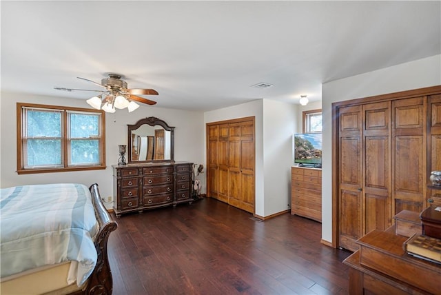 bedroom with dark wood-type flooring and ceiling fan