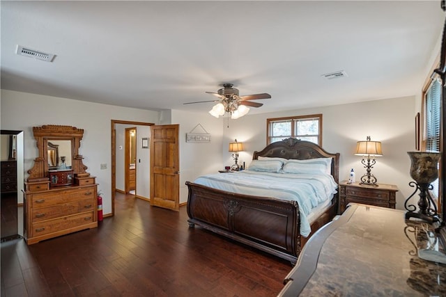 bedroom featuring ceiling fan and dark hardwood / wood-style floors