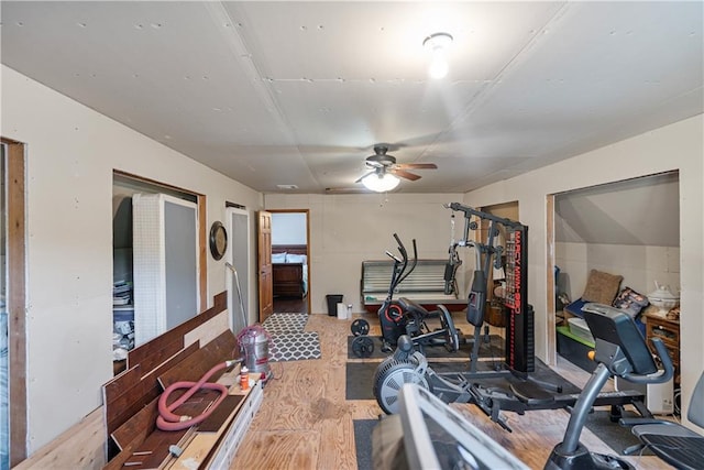 exercise room with ceiling fan