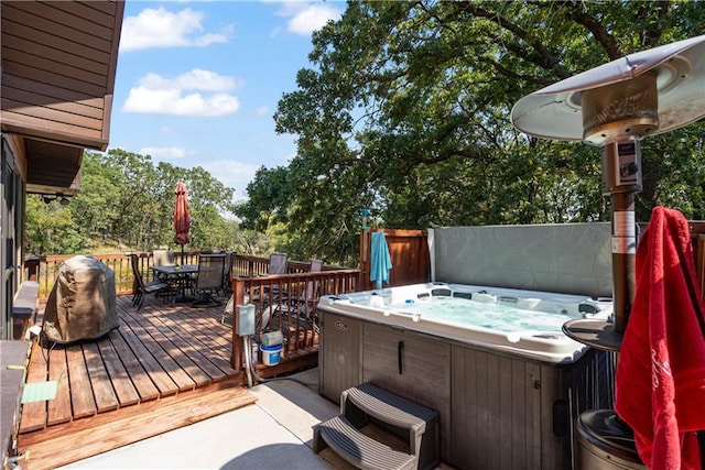 wooden terrace featuring a hot tub