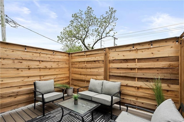 wooden deck featuring outdoor lounge area