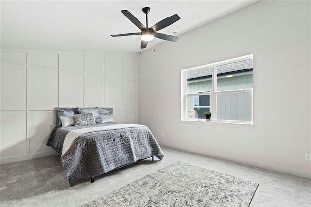 carpeted bedroom with lofted ceiling and ceiling fan