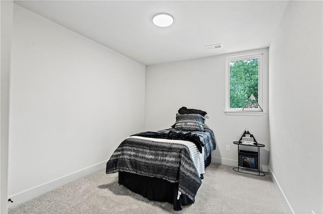 bedroom featuring light colored carpet