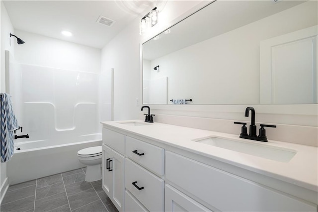 full bathroom with tile patterned flooring, shower / tub combination, vanity, and toilet