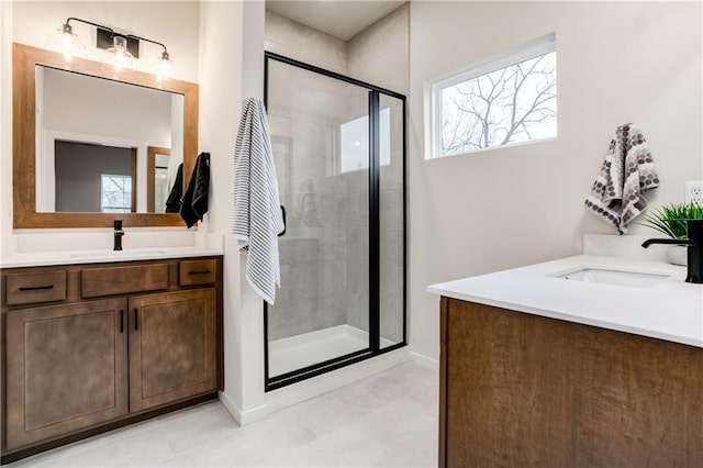 bathroom with tile patterned flooring, vanity, and an enclosed shower